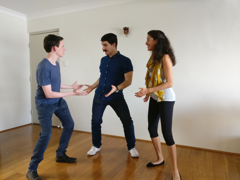 Photo of a student with teachers in a private class